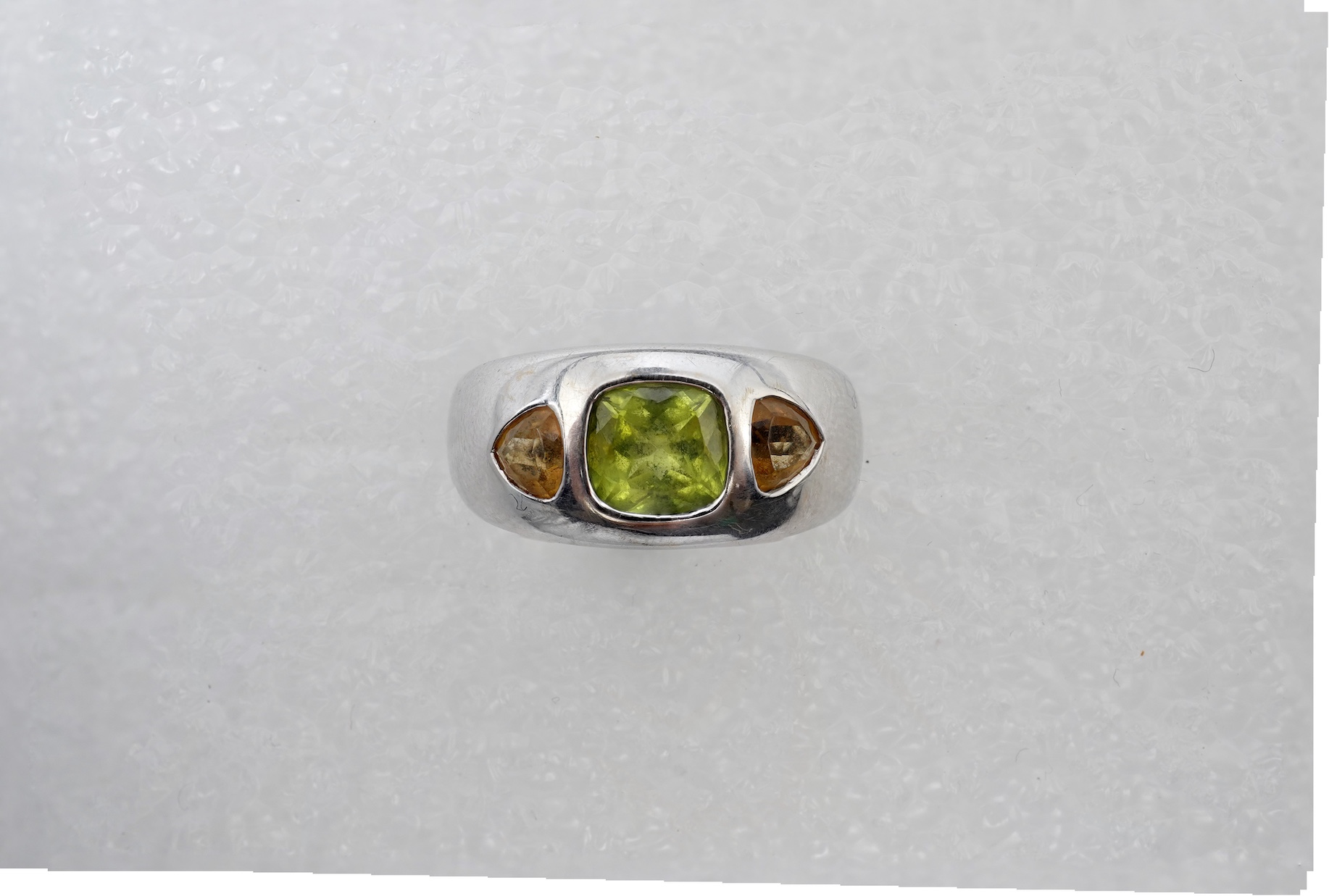 A peridot and citrine dress ring